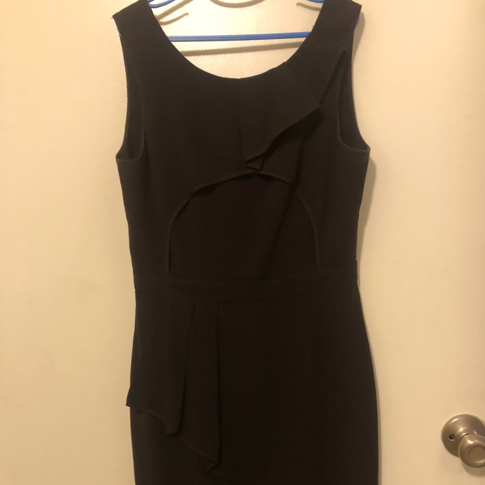 Black tight fitted above the knee dress.